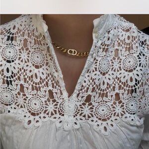 White Lace Blouse with Gold Necklace